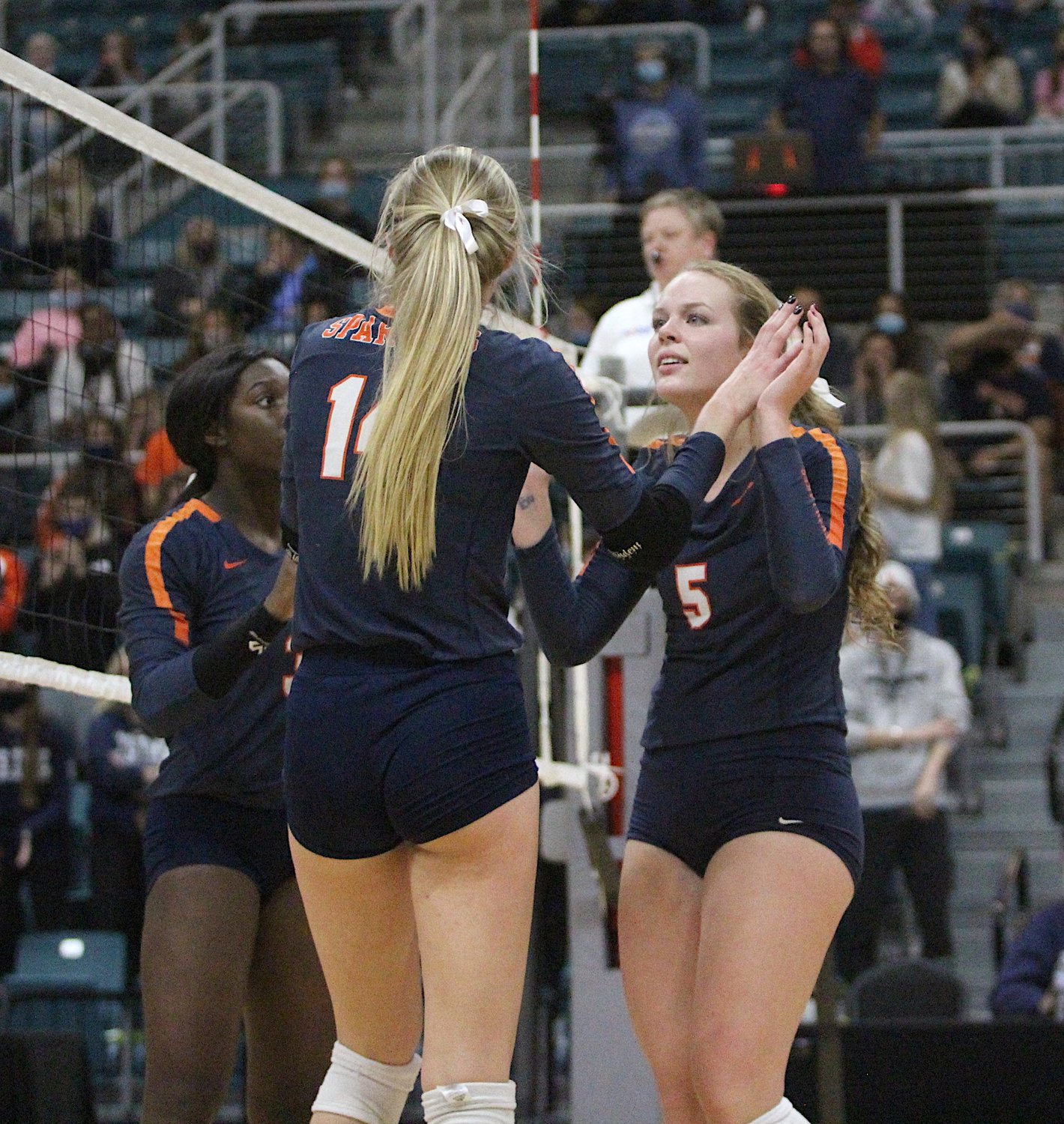 Seven Lakes senior Ally Batenhorst (front) and junior Casey Batenhorst (right) are enjoying the Spartans’ remarkable run to the Class 6A state volleyball final. Ally is returning to the state final after making it with her older sister, Dani, in 2017. Now with younger sister Casey, she’s hoping the second time can bring home a state title.